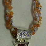 1277 Full Orange Glow NK 14KTT hinged slide with orange sapphire and dia on multistrand NK